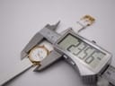 The Longines Presence watch being measured by a digital caliper, displaying a case diameter of 23.56mm.