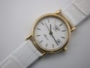 Close-up, slightly angled top view of the Longines Presence dial, with the white crocodile-effect leather strap visible.