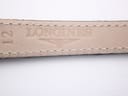 Close-up of the reverse side of the black leather strap, showing the embossed 'Longines' logo and '12' (indicating lug width).