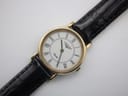 Slightly angled close-up of the Longines watch dial and upper strap, emphasising the white dial and crisp Roman numerals.