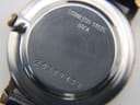 Close-up of the polished stainless steel case back, engraved with 'STAINLESS STEEL BACK' and the serial number '20389138'.