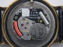 Detailed view of the Longines calibre 557.2 Swiss quartz movement, showing 'FIVE 5 JEWELS' and a Renata 364 battery.
