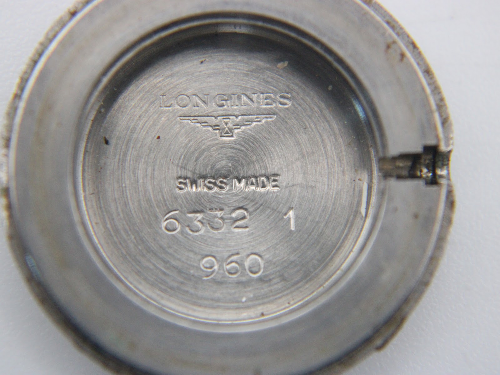 Interior view of the case back, engraved with 'LONGINES SWISS MADE' and model reference numbers '6332 1 960'.