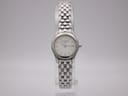 Front view of the Longines L4.215.4 quartz watch on a clear stand, showing the white dial and stainless steel bracelet.