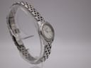 Oblique front view of the Longines L4.215.4 watch on a clear stand, showcasing the dial and polished finish.