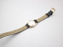 Angled close-up of the Longines manual wind movement, showing 'Longines Watch Co Swiss' and 'Seventeen 17 Jewels Unadjusted'.