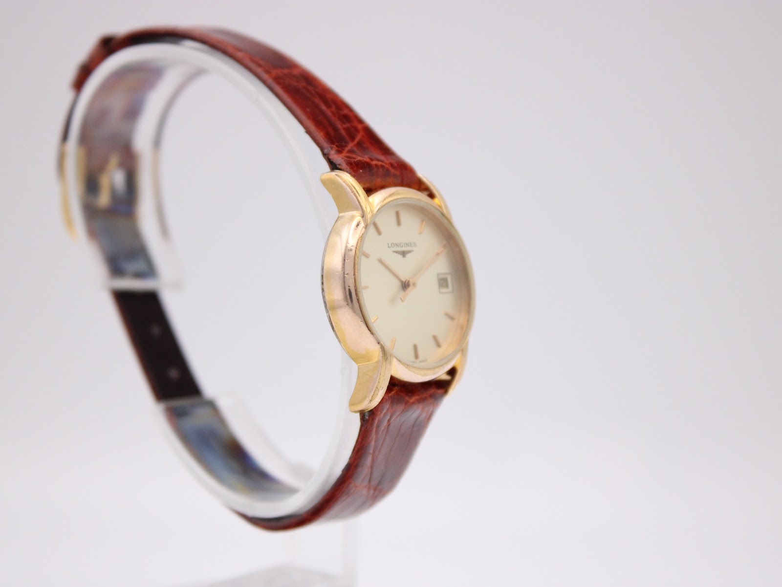 Another angled side view of the Longines L4.197.2 watch, showing the crown and case profile.