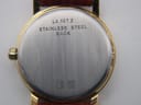 Close-up of the watch case back, engraved with model L4.197.2, 'STAINLESS STEEL BACK', serial 28871540, and water resistance marking '30'.