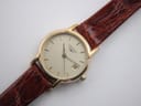 Overhead close-up of the watch dial, showing the Longines logo, baton indices, date window, and 'SWISS MADE' text.