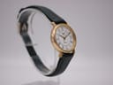 Angled left-side view of the Longines Presence watch highlighting the case profile and green strap.