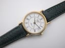 Overhead flat lay view of the Longines Presence watch with its white dial and green leather strap.