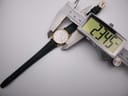 Digital caliper measuring the case diameter of the Longines Presence watch at 23.45mm.