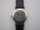 Rear view of the watch case back, with "STAINLESS STEEL BACK" and serial number "21766854" engraved.