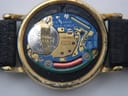 Detailed view of the Swiss quartz movement inside the watch, showing the Longines branding and six jewels.
