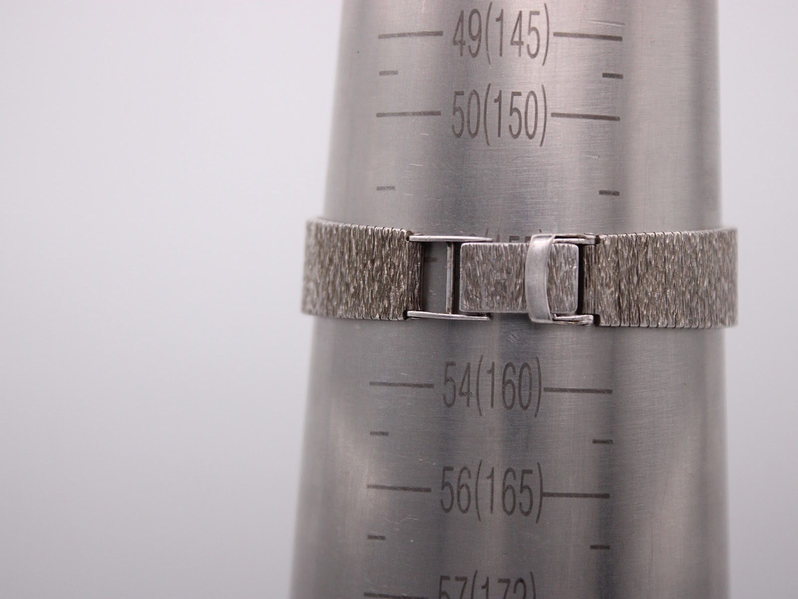 Watch on a wrist sizing cone, indicating a wrist circumference of approximately 160mm / 16cm.