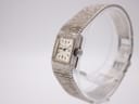 Angled view of the Longines watch showing the textured sterling silver case, crown detail, and bracelet.