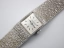 Close-up front view of the Longines 410's silver dial with applied baton indices and subtle texture.