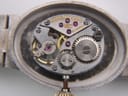 Detailed view of the Longines manual wind 5601 movement, showcasing 17 jewels, 'Longines Watch Co Swiss' engraving, and serial number 51433923.