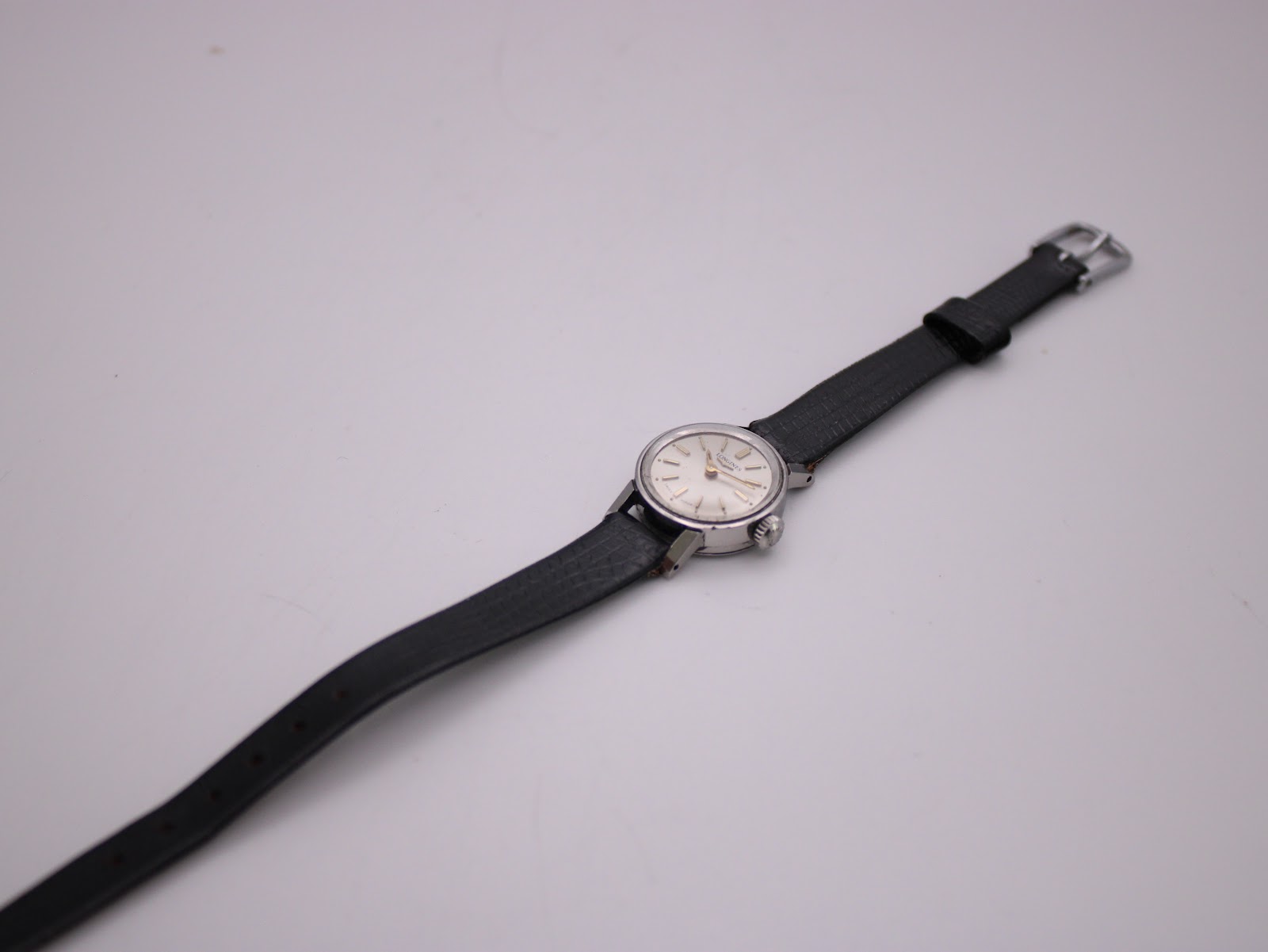 Angled overhead view of the Longines 7271 watch from the back, displaying the overall length of the strap and the case back.