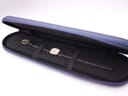The Longines watch neatly placed inside its original navy blue zip-up travel case.