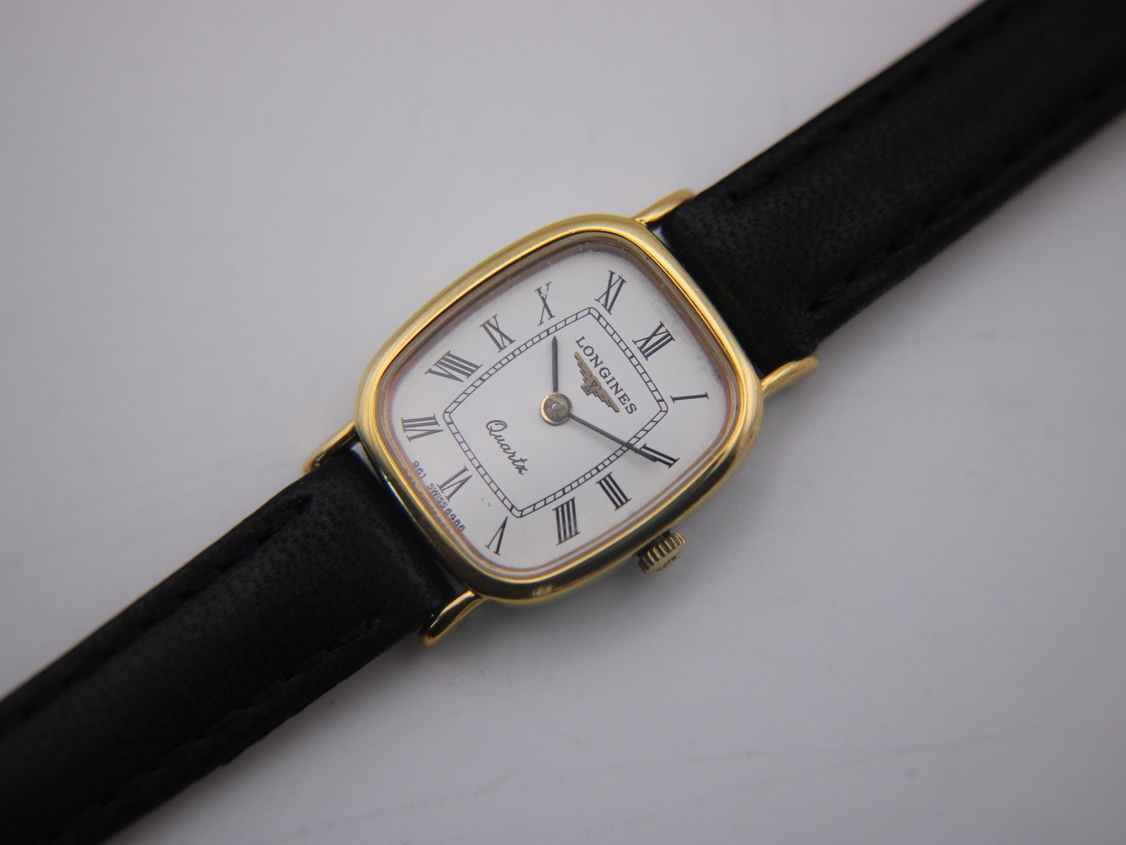 Close-up front view of the Longines 6486 dial, showing Roman numerals, brand logo, and 'Quartz' text.