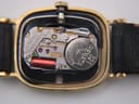 Macro shot of the Longines L961.2 Swiss quartz movement with a Renata 321 battery visible inside the watch case.