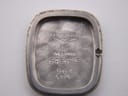 Close-up of the inside of the case back showing Longines branding, 'Swiss Made', model number 6486 5, and service marks including a date '4/12/92'.