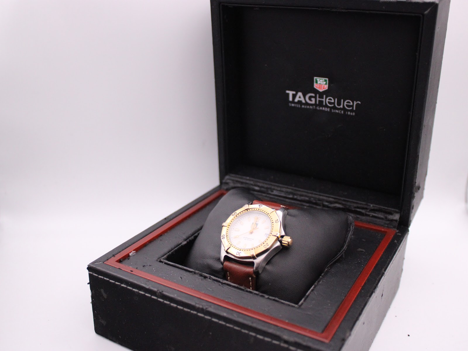 The TAG Heuer Professional WK1220 watch presented inside its original black branded box.