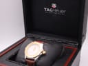 Close-up of the watch within its box, with the TAG Heuer logo visible on the inner lid.