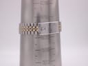 The Tissot PR 100 bracelet on a wrist sizing cone, indicating a maximum wrist circumference of approximately 19.8cm.