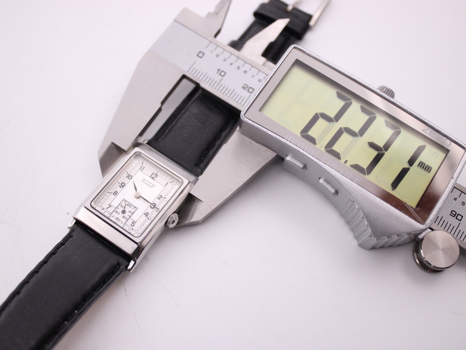 Digital caliper measuring the width of the Tissot Z173K case, showing a precise measurement of 22.31mm.