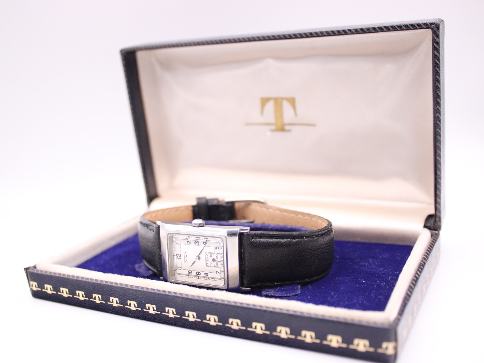 The Tissot Z173K watch resting inside its original blue Tissot presentation box with a cream interior.