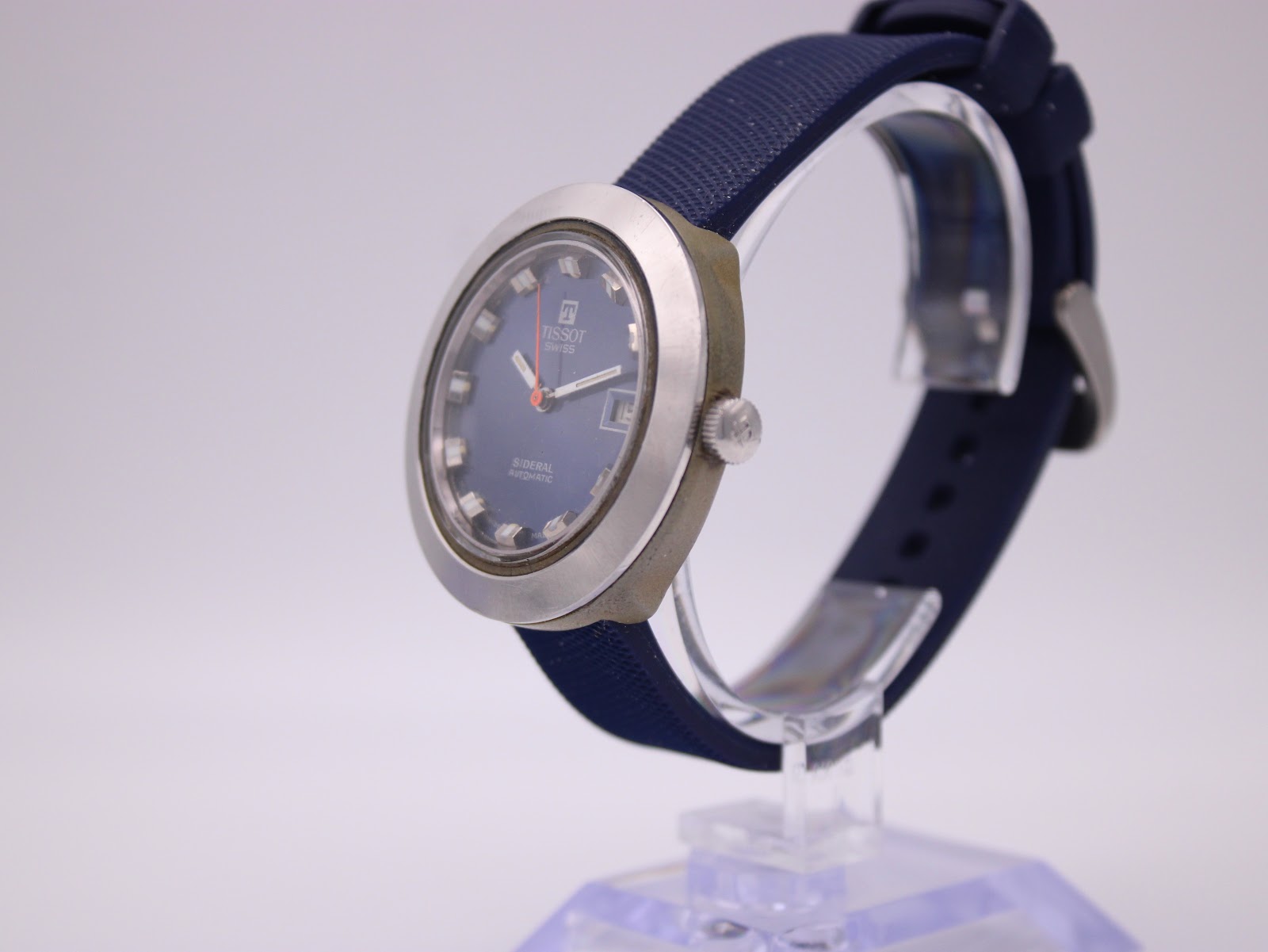 Angled side view of the Tissot Sideral, highlighting the fibreglass case and brushed stainless steel bezel.