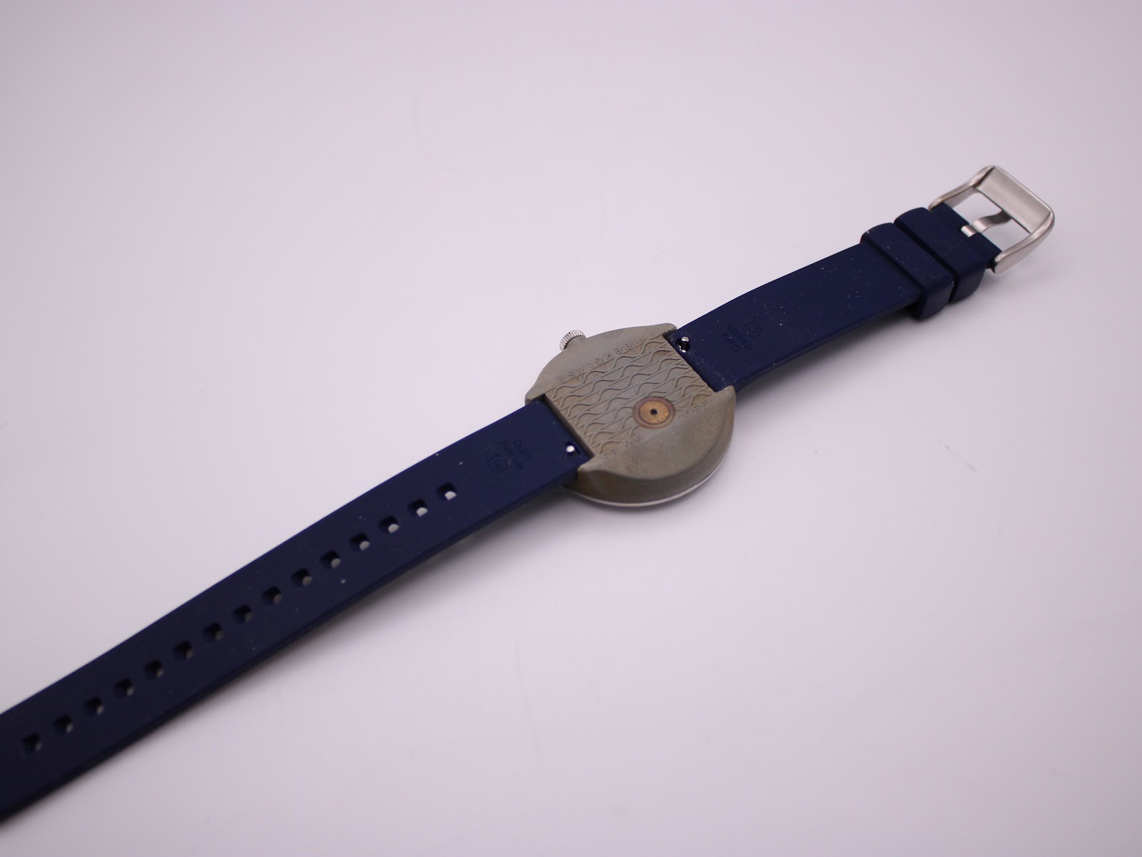 Underneath view of the Tissot Sideral, showing the textured fibreglass case back and the underside of the strap.