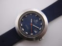 Close-up of the Tissot Sideral's blue dial, showing the Tissot logo, Sideral Automatic text, date window, and baton indices.