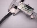Digital caliper measuring the Eterna watch case diameter at 25.86mm.