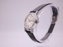 Side profile of the Eterna watch, showing the crown and case thickness.
