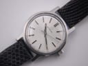 Close-up of the Eterna watch dial, showing the applied logo, text, and baton indices.