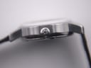 Close-up of the watch crown, showing its textured finish.