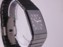 Top-down view of the Rado Diastar watch with its black ceramic case and bracelet laid flat, showing the full length.