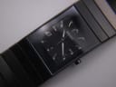 Lume shot of the Rado Diastar dial, showing the bright green glow of the luminous hands and hour markers in the dark.