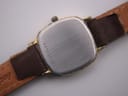 Digital caliper measuring the Longines Presence watch case, showing a precise diameter of 23.50mm.