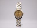 Front view of the Omega 595.1055 quartz watch, showing gold dial, diamond indices, and two-tone bracelet.