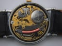 Detailed close-up of the Omega Swiss quartz movement inside the watch, with a Renata battery visible.