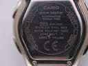 Macro shot of the stainless steel case back with "CASIO wave ceptor WVA-430U" and "Water Resistant 10BAR" engravings.