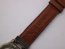 Close-up of the upper brown leather strap section, featuring an embossed camel logo and 'CAMEL' lettering.