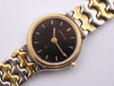 Overhead close-up of the Certina watch dial and integrated two-tone bracelet links.
