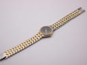 Full length view of the Certina watch and bracelet laid flat, showing the two-tone design.
