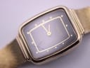 Close-up of the Tissot watch dial and crystal, highlighting visible scratches and cracks on the acrylic surface.
