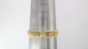 Gold bracelet of the Raymond Weil 9954 measured on a wrist sizing gauge, showing 17.8cm circumference.